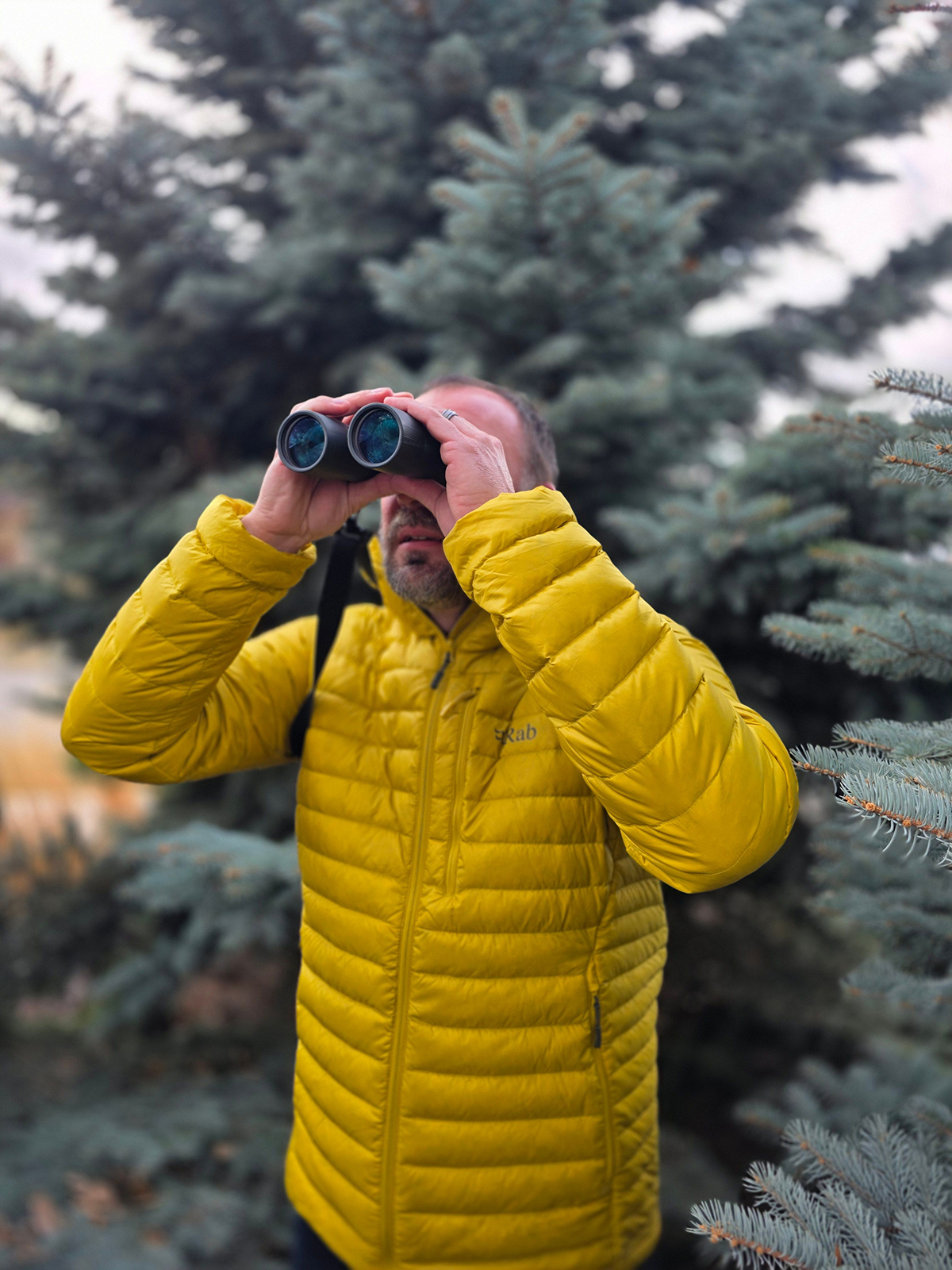 Jared Pettyjohn wearing the Rab Microlight Alpine Down Jacket as a go-to layer for early mornings in the field.